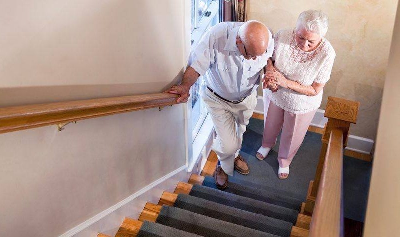 old age couple moving upstairs